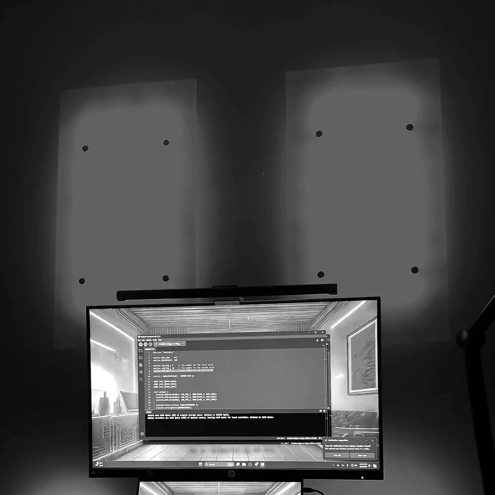 An LED wall installation with the FastLED code driving it visible on screen